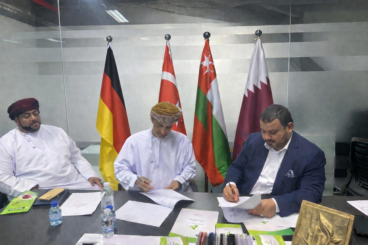 Majan team signing partnership documents