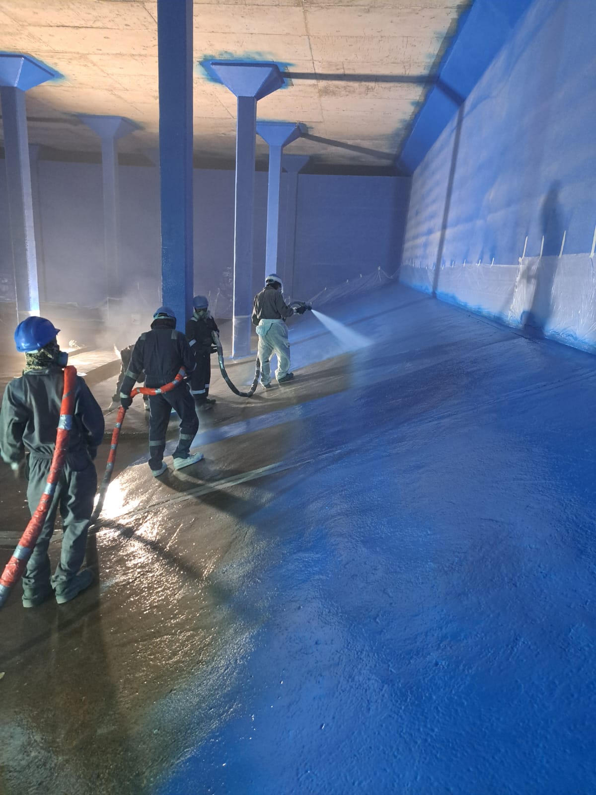 Professional trowel application of protective coating on industrial column